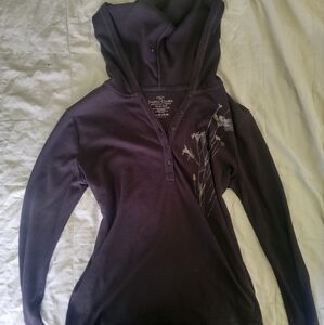 black hooded long sleeved shirt with flower detailing